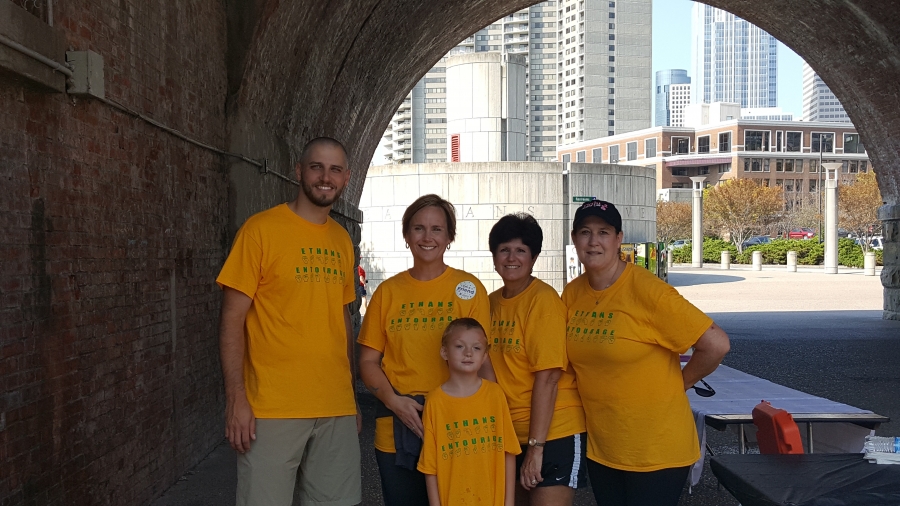 Ethan with his principal and teachers at the walk.